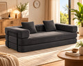 The Comfy 4-in-1 sofa bed in a bright living room — Charcoal Grey